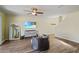 Bright and spacious living room with wood-look floors, modern furniture, and plenty of natural light at 4502 Banyan Tree Pl, Riverview, FL 33578