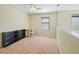 Cozy upstairs loft space featuring neutral walls, carpet and a ceiling fan at 4502 Banyan Tree Pl, Riverview, FL 33578
