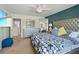 Comfortable main bedroom with neutral colors, lots of closet space, and a ceiling fan at 4502 Banyan Tree Pl, Riverview, FL 33578