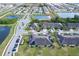 Community view featuring ponds, sidewalks, and lush greenery, showcasing a tranquil neighborhood setting at 1718 Trailwater St, Ruskin, FL 33570