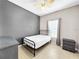 Small bedroom with neutral walls and a black-framed bed at 1718 Trailwater St, Ruskin, FL 33570