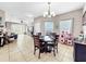 Open-concept dining area near the living room and kitchen with decorative plates on the table at 1718 Trailwater St, Ruskin, FL 33570