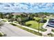 Charming single-story home with a well-manicured lawn, palm trees, and inviting curb appeal at 1718 Trailwater St, Ruskin, FL 33570