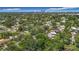 A tranquil neighborhood, framed by lush trees and city skyline views in the distance at 4202 W Bay Vista Ave, Tampa, FL 33611