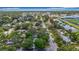 A quiet neighborhood street near a large school, pond, and recreation fields at 4202 W Bay Vista Ave, Tampa, FL 33611