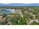 A quiet neighborhood street near a large school, pond, and recreation fields at 4202 W Bay Vista Ave, Tampa, FL 33611