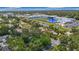 A school near a quiet neighborhood street with pond and recreation fields at 4202 W Bay Vista Ave, Tampa, FL 33611