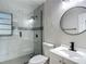 Updated bathroom featuring a glass shower and a vanity at 4202 W Bay Vista Ave, Tampa, FL 33611