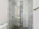 Contemporary bathroom, tile shower with glass door, rain shower head and built-in niche at 4202 W Bay Vista Ave, Tampa, FL 33611
