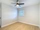 Bedroom featuring a ceiling fan, wood flooring, and a window at 4202 W Bay Vista Ave, Tampa, FL 33611
