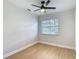 Neutral bedroom featuring modern ceiling fan, new flooring, and ample natural light at 4202 W Bay Vista Ave, Tampa, FL 33611