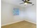 Bedroom with wood-look floors, a window, and natural light at 4202 W Bay Vista Ave, Tampa, FL 33611