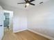 Bright bedroom with new flooring, white trim, and ensuite bathroom with step-in shower at 4202 W Bay Vista Ave, Tampa, FL 33611