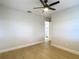 Bedroom with wood-look floors and access to a bathroom at 4202 W Bay Vista Ave, Tampa, FL 33611