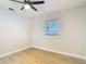 Bedroom with wood-look floors and bright natural light at 4202 W Bay Vista Ave, Tampa, FL 33611