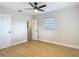 Bright bedroom featuring new ceiling fan, hardwood floors, closet and a window at 4202 W Bay Vista Ave, Tampa, FL 33611