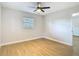 An inviting bedroom with window, lighting and hardwood floors at 4202 W Bay Vista Ave, Tampa, FL 33611
