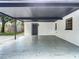 Attached carport provides covered parking and features access to backyard storage at 4202 W Bay Vista Ave, Tampa, FL 33611