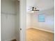 Bedroom closet with access to room with window and ceiling fan at 4202 W Bay Vista Ave, Tampa, FL 33611