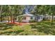 Well-maintained home with landscaping and mulch, offering great curb appeal at 4202 W Bay Vista Ave, Tampa, FL 33611