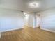 Bright living room with wood flooring, contemporary light fixtures and neutral paint at 4202 W Bay Vista Ave, Tampa, FL 33611