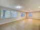Spacious living room with wood flooring and an abundance of natural light at 4202 W Bay Vista Ave, Tampa, FL 33611