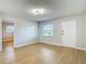 Bright living room with wood flooring, contemporary light fixtures and neutral paint at 4202 W Bay Vista Ave, Tampa, FL 33611