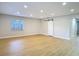 Large living room featuring wood flooring and recessed lighting at 4202 W Bay Vista Ave, Tampa, FL 33611