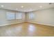 Bright living room featuring hardwood floors, neutral paint, recessed lighting, and great natural light at 4202 W Bay Vista Ave, Tampa, FL 33611