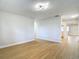 Bright living room with wood flooring, contemporary light fixtures and neutral paint at 4202 W Bay Vista Ave, Tampa, FL 33611