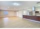 Open-concept living area showcasing updated flooring and easy flow to kitchen at 4202 W Bay Vista Ave, Tampa, FL 33611