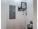 Mechanical room featuring electrical panel and new tankless water heater at 4202 W Bay Vista Ave, Tampa, FL 33611