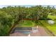 Aerial view of the property's layout, highlighting the pool, yard, and mature trees at 4401 W Sam Allen Rd, Plant City, FL 33565