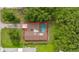 Aerial view highlighting the property's layout, including the pool, patio, and surrounding greenery at 4401 W Sam Allen Rd, Plant City, FL 33565