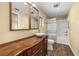 Traditional bathroom featuring a wooden vanity with vessel sink and a shower-tub combo at 4401 W Sam Allen Rd, Plant City, FL 33565