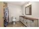 Remodeled bathroom includes a custom vanity, mirror, and farmhouse-style details at 4401 W Sam Allen Rd, Plant City, FL 33565