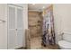 Updated bathroom with tiled shower, grab bar, and neutral color scheme at 4401 W Sam Allen Rd, Plant City, FL 33565