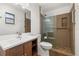 Updated bathroom featuring a new vanity, toilet and tiled glass shower at 4401 W Sam Allen Rd, Plant City, FL 33565