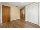Bedroom with wood floors and closet doors at 4401 W Sam Allen Rd, Plant City, FL 33565