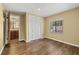 Bedroom with wood floors, a window, and an ensuite bathroom at 4401 W Sam Allen Rd, Plant City, FL 33565