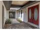 Welcoming front entrance featuring brick pavers, plants, and a double door entry at 4401 W Sam Allen Rd, Plant City, FL 33565