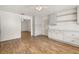 Kitchen with wood floors, bright cabinets, and a decorative ceiling at 4401 W Sam Allen Rd, Plant City, FL 33565