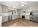 A kitchen showcasing stainless steel appliances, bright white cabinets, and a decorative ceiling design at 4401 W Sam Allen Rd, Plant City, FL 33565