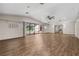 Bright living room featuring hard surface floors and access to the pool area at 4401 W Sam Allen Rd, Plant City, FL 33565