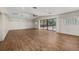 Bright living room featuring hard surface floors and access to the pool at 4401 W Sam Allen Rd, Plant City, FL 33565