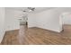 A bright living room provides hard surface floors and a view of the kitchen at 4401 W Sam Allen Rd, Plant City, FL 33565