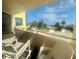 Enjoy scenic views from this condo's private balcony with comfortable seating and tranquil water views at 6009 Sea Ranch Dr # 203, Hudson, FL 34667