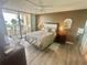 Cozy bedroom with balcony access and water views offers a peaceful retreat at 6009 Sea Ranch Dr # 203, Hudson, FL 34667