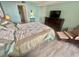 Tranquil bedroom featuring a comfortable bed, dresser, and TV, creating a relaxing atmosphere at 6009 Sea Ranch Dr # 203, Hudson, FL 34667