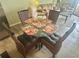 Comfortable dining area with stylish round table with seating for four at 6009 Sea Ranch Dr # 203, Hudson, FL 34667